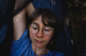 Woman napping on hammock