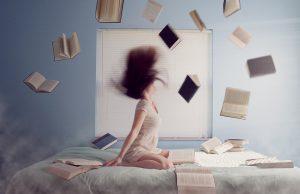 Woman with books flying