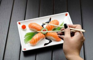 Person eating sushi